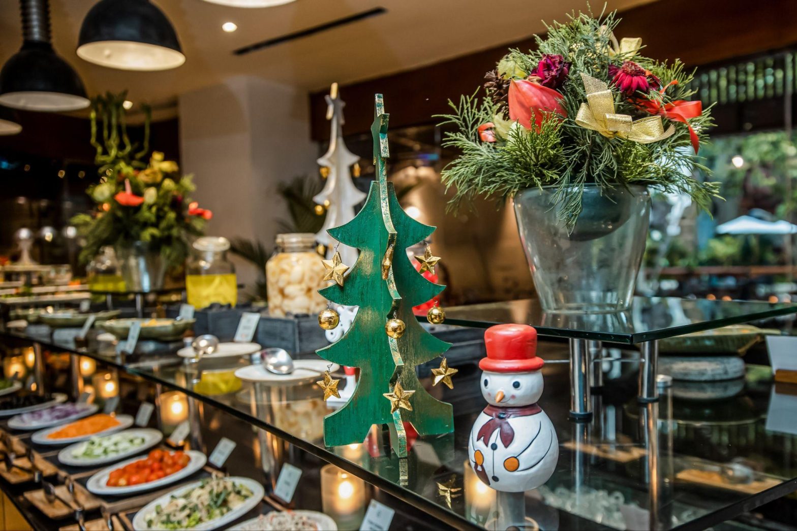 Festive holiday catering buffet with Christmas decor and seasonal salads, representing Seattle holiday event planning by Chef Dane Catering