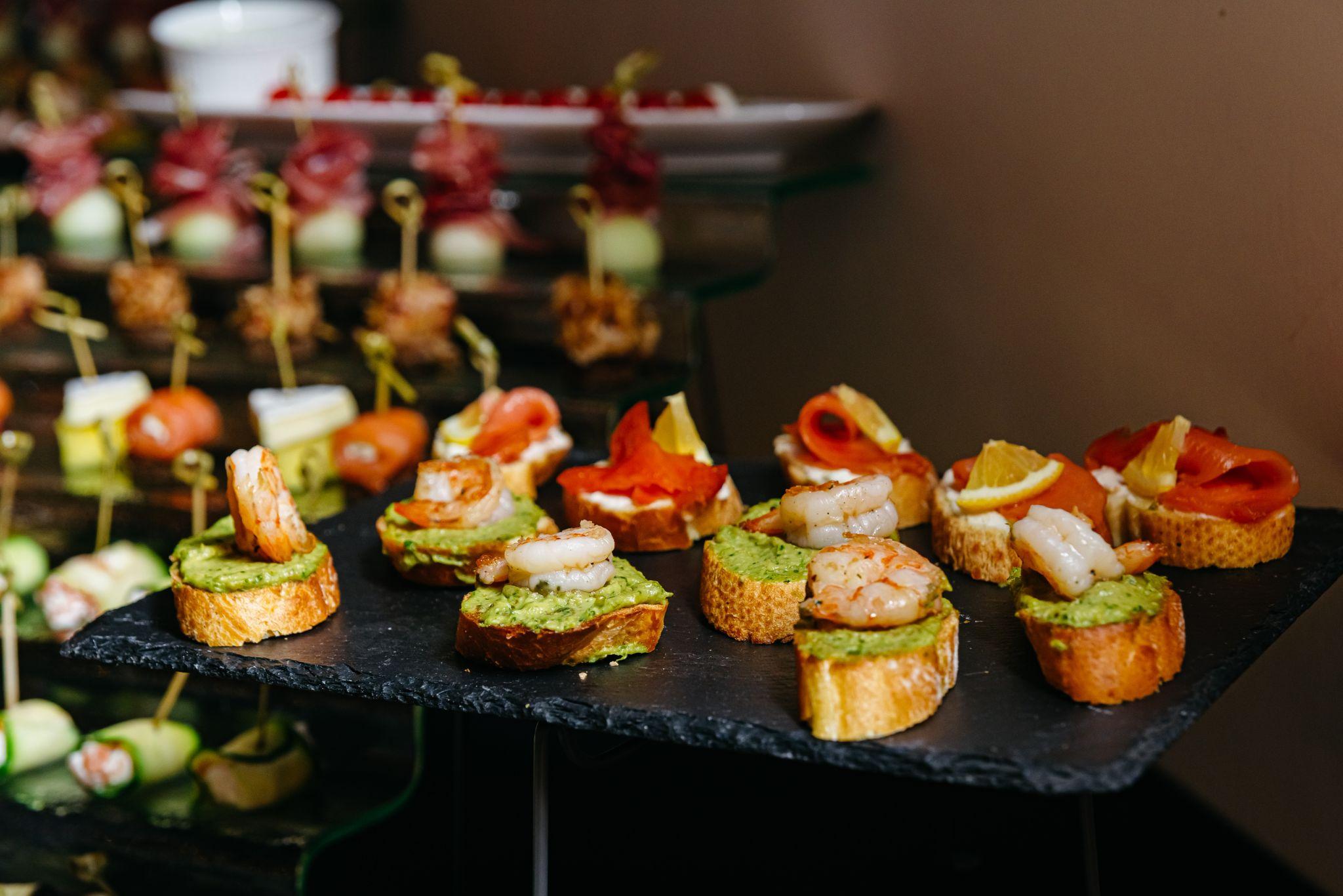 Assorted wedding appetizers with shrimp and smoked salmon bruschetta 
